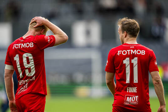 Sivert Heltne Nilsen and Bård Finne of Brann looks dejected