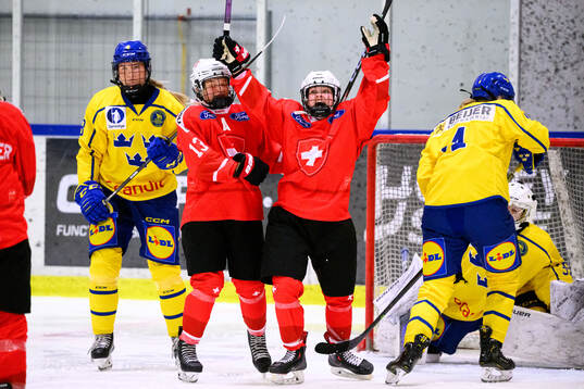 Lorie Besson-Lou of Switzerland celebrates