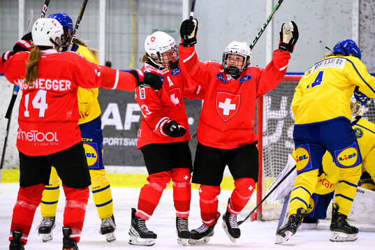 Lorie Besson-Lou of Switzerland celebrates