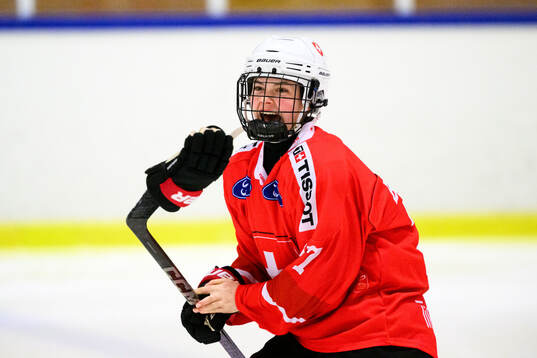Lorie Besson-Lou of Switzerland celebrates