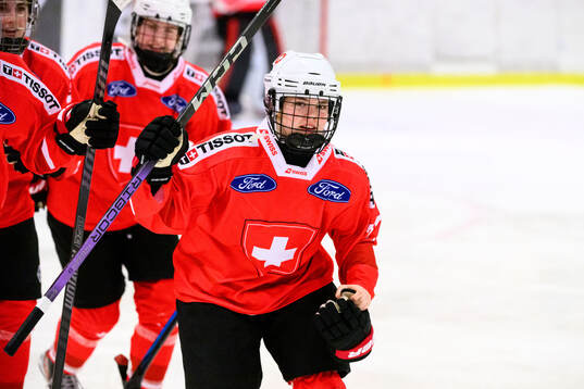 Lorie Besson-Lou of Switzerland celebrates