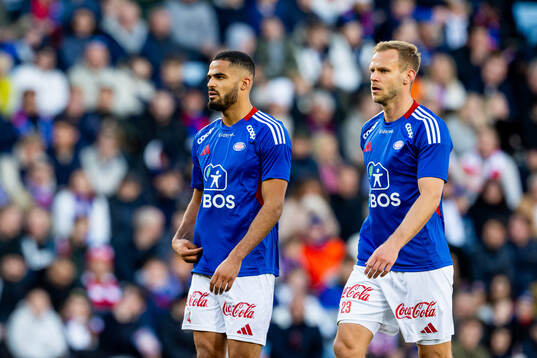 Aaron Kiil Olsen and Martin Kreuzriegler of Vålerenga