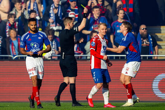 Mees Rijks of Vålerenga receives his second yellow card