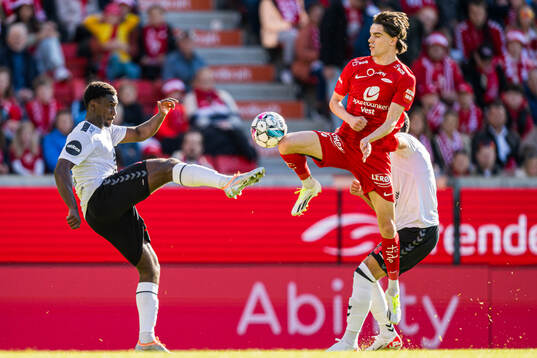 Tony Miettinen of Odd and Ulrik Mathisen of Brann