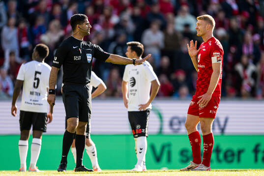 Mohammad Usman Aslam, referee, and Sivert Heltne Nilsen of