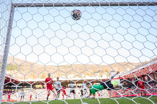 Aune Heggebø of Brann scores the 2-0 goal behind Casper