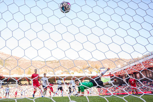 Aune Heggebø of Brann scores the 2-0 goal behind Casper