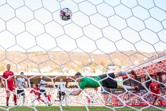 Aune Heggebø of Brann scores the 2-0 goal behind Casper