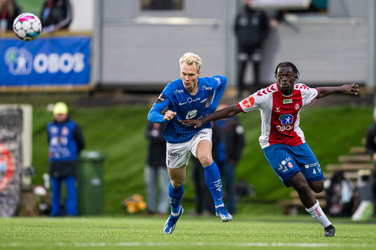Magnus Warming of Brann and Momodou Lion Njie of KFUM