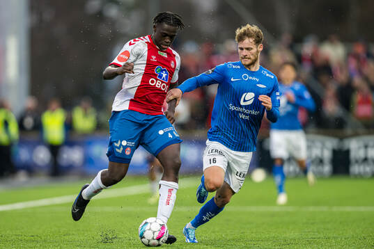 Momodou Lion Njie of KFUM and Ole Didrik Blomberg of Brann