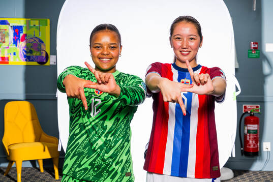 Goalkeeper Maria Kroken and Henny Thorallsson of the