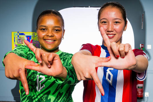 Goalkeeper Maria Kroken and Henny Thorallsson of the