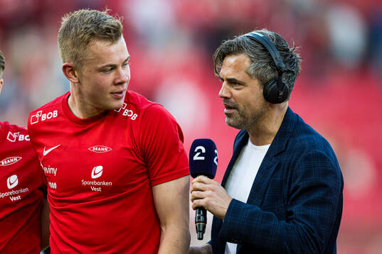 Aune Heggebø of Brann and Jan-Henrik Børslid of TV 2 the