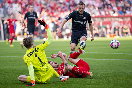 Sander Tangvik of Rosenborg and Ole Didrik Blomberg of Brann