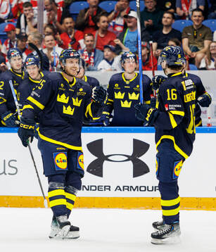 Jonas Brodin and Felix Unger Sörum of Sweden celebrate the