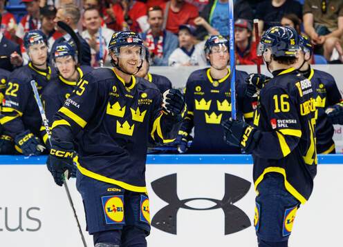 Jonas Brodin and Felix Unger Sörum of Sweden celebrate the