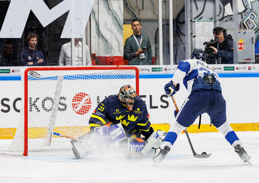 Goaltender Samuel Ersson of Sweden and Jesse Puljujärvi of