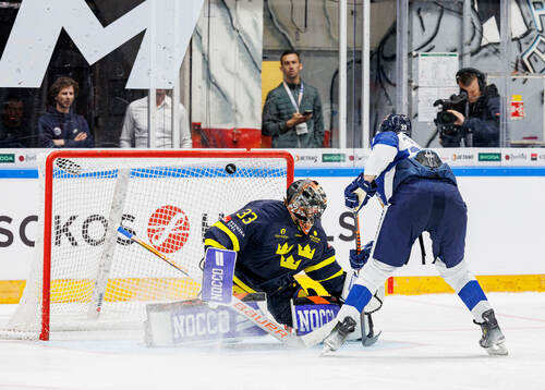 Goaltender Samuel Ersson of Sweden and Jesse Puljujärvi of