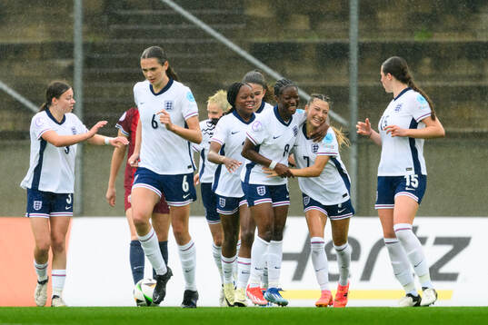 Omotara Junaid and Erica Parkinson of England celebrate the
