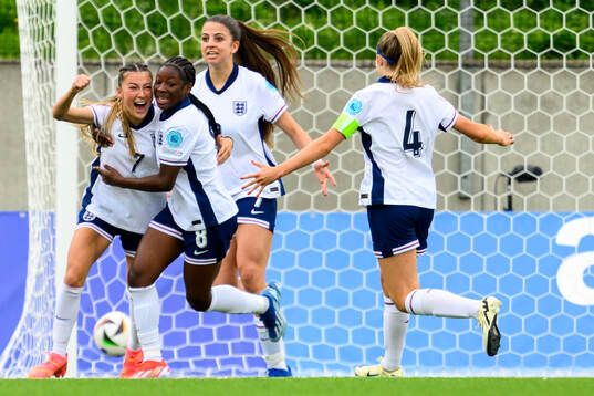 Erica Parkinson and Omotara Junaid of England celebrate