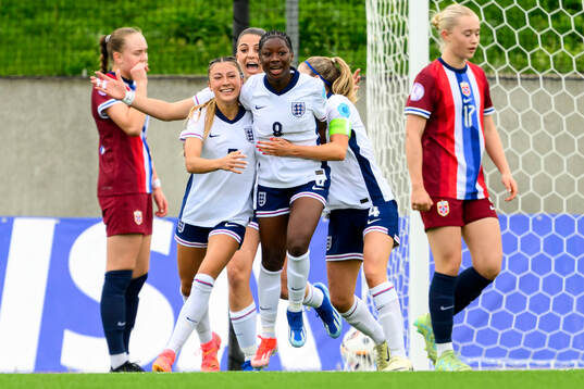 Erica Parkinson and Omotara Junaid of England celebrate