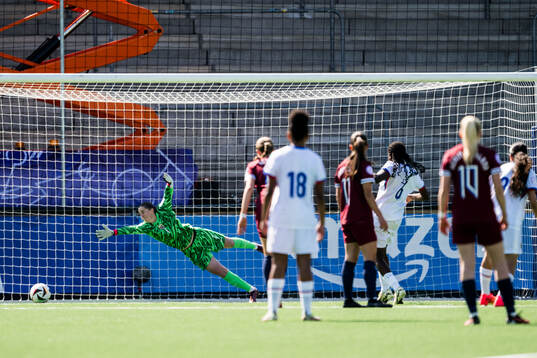Goalkeeper Hanna Krog of Norway and Anais Ebayilin of France