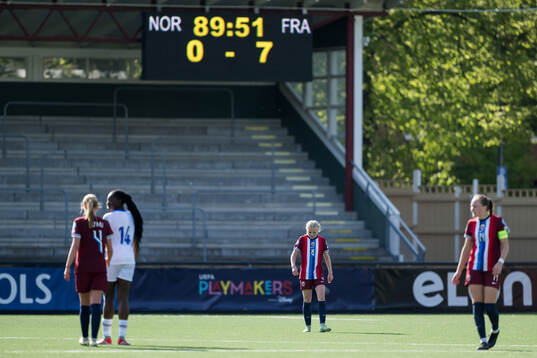 Linnea Holmesveen Moen of Norway looks dejected