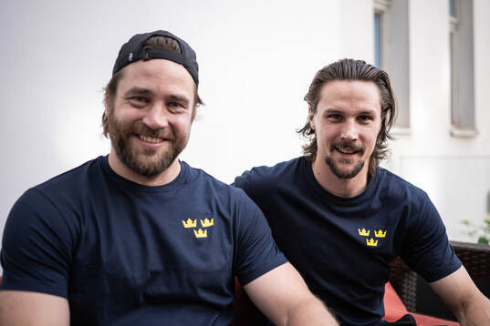 Victor Hedman and Erik Karlsson pose for a picture at a