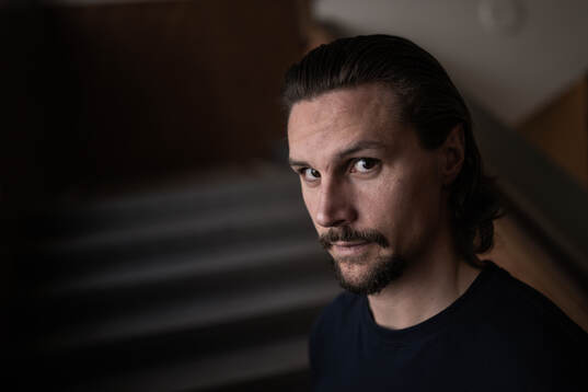 Erik Karlsson poses for a portrait at a press event with