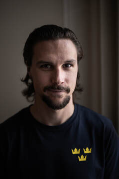 Erik Karlsson poses for a portrait at a press event with