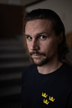 Erik Karlsson poses for a portrait at a press event with