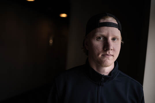 Rasmus Dahlin poses for a portrait at a press event with
