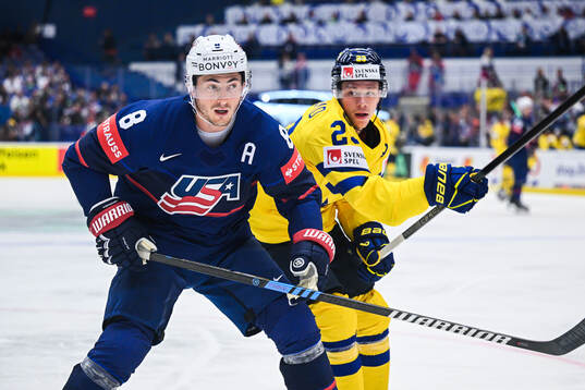 Zach Werenski of USA and Lucas Raymond of Sweden