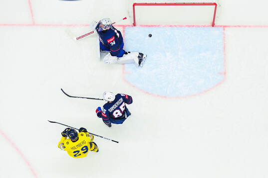 Goaltender Alex Lyon of USA looks dejected
