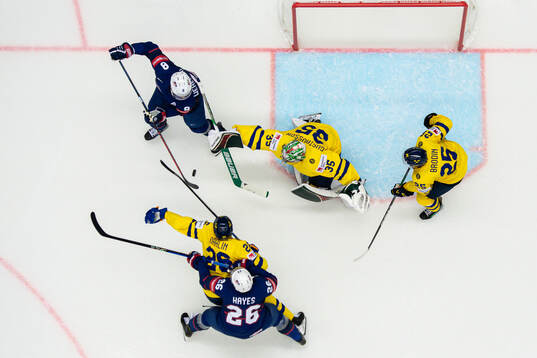 Zach Werenski and Kevin Hayes of USA against Rasmus Dahlin,
