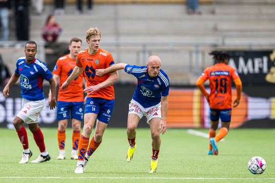 Simen Vatne Haram of Aalesund and Petter Strand of