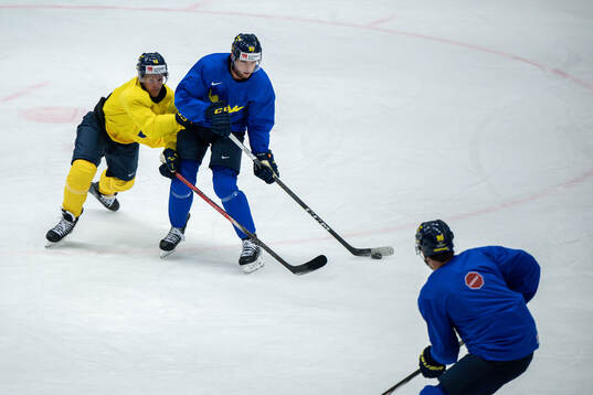 Max Friberg and André Burakovsky of Sweden at a practice