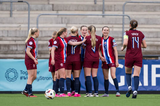 Ina Raaum Andreassen of Norway celebrates with her team