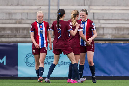 Ina Raaum Andreassen of Norway celebrates with her team