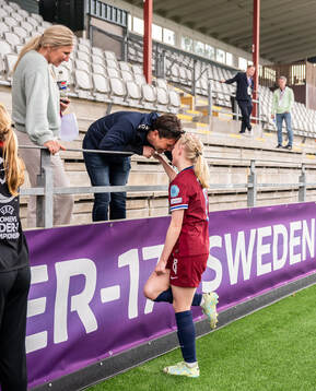 Linnea Holmesveen Moen of Norway with family in the stands