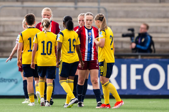 Ina Raaum Andreassen of Norway with Maja Nilsson, Saron