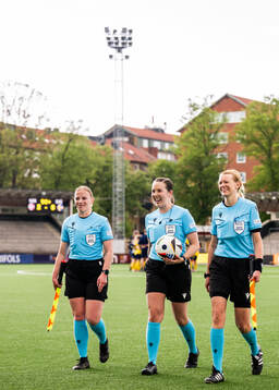 Referee Lotta Vuorio with assistant referees Katrine