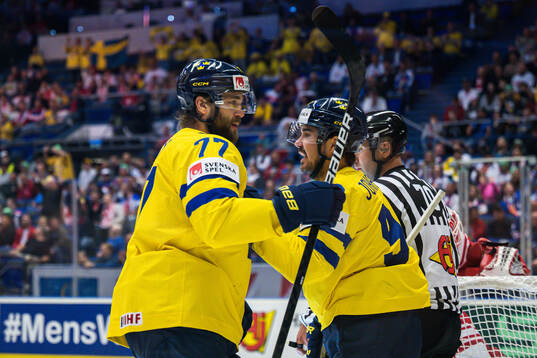 Victor Hedman and Marcus Johansson of Sweden celebrate