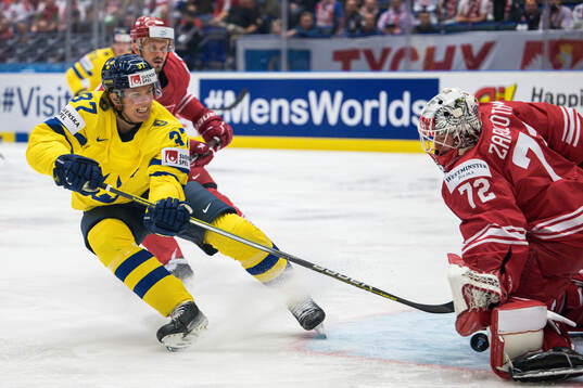 Isac Lundeström of Sweden and goaltender David Zabolotny