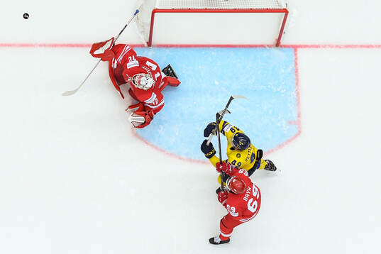Goaltender David Zabolotny and Mateusz Bryk of Poland