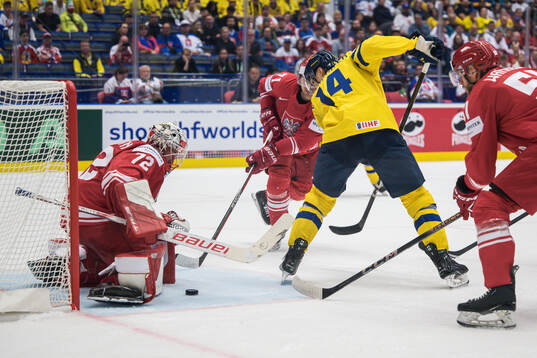 Goaltender David Zabolotny of Poland and Joel Eriksson Ek