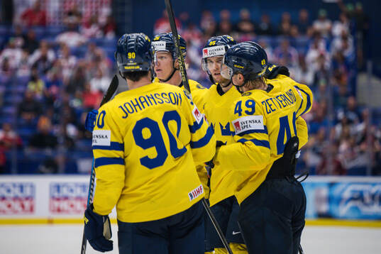 André Burakovsky of Sweden celebrates with team mates