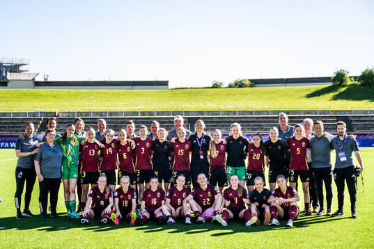 Players and staff of Belgium pose for a picture