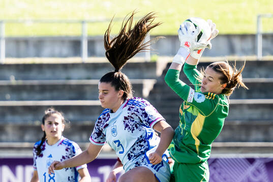 Nerea Carmona of Spain in action with goalkeeper Aude