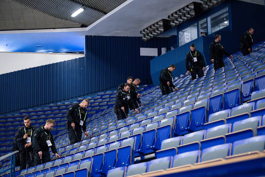 The police search the arena for suspicious objects